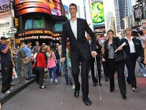 The world's tallest man, Sultan Kosen of Turkey, walks in New York's Times Square in this September 2009 photo.