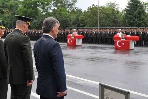 President Abdullah Gul (2nd left) attends a funeral ceremony for the victims of a bus bomb attack