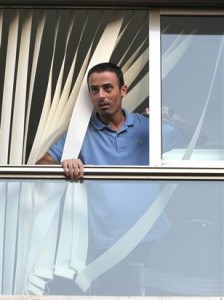 Photo: MAARIV/Reuters - Nadim Injaz looks out of a window at the Turkish embassy in Tel Aviv, Aug. 17. The Palestinian man known to Israeli police was shot and wounded by Turkish embassy security guards on Tuesday after breaking into the mission in Tel Aviv and holding hostages.